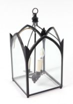 A Victorian style hall lantern with Gothic arches and glass panels.