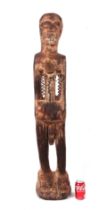 A large carved hardwood male fertility figure, approx 118cms high.