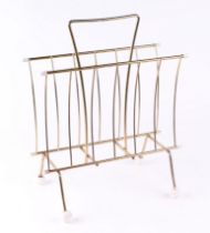 A mid 20th century Sputnik type two-division magazine rack, 34cms wide.