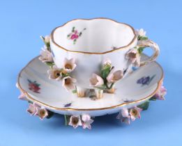 A 19th century Meissen flower encrusted cabinet cup and saucer. Condition Report The cup has minor