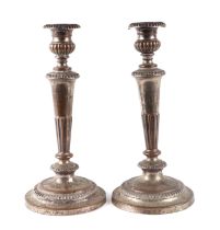 A pair of Sheffield plate candlesticks, 33cms high. Condition Report The plate is worn.