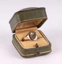 A 9ct gold signet ring with armorial, 7g, approx UK size L. Condition Report There is general wear