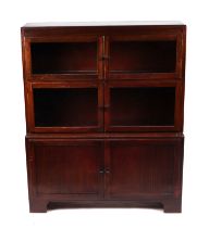 A 1930's Minty of Oxford mahogany modular three-section bookcase, 90cms wide.