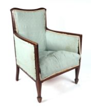 An Edwardian inlaid mahogany armchair.