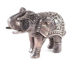 An Indian / Nepalese silver coloured metal model of an elephant, 17cms long.