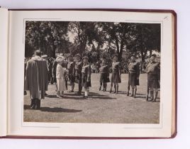 A mid 20th century black & white photograph album depicting the Queen Mother on her Royal visit to