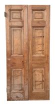 A pair of large oak doors, each with three panels, both 208cms high and 48cms wide (2).