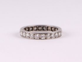 A white metal diamond set eternity ring, approx UK size L. 3.4g.