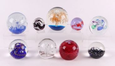 A small collection of paperweights to include Caithness Journey, Goldrush, Ambrosia, Moon Crystal