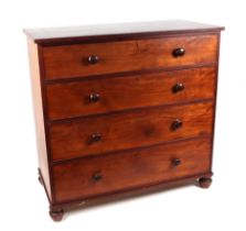 A Victorian mahogany chest of four graduated long drawers, on bun feet, 114cms wide.