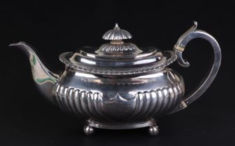 A George IV silver teapot, London 1820, 665g. Submission reference MF71X1F7