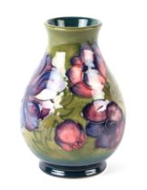 A Moorcroft Pottery Anemone pattern vase, 13cms high. Condition Report Good condition with some