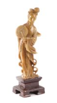A Chinese soapstone figure depicting Guanyin, 20cms high.
