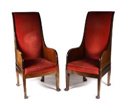 A pair of walnut high back throne type chairs with lion paw front feet (2). Condition Report