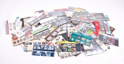 A large quantity of Presentation Pack stamps and loose stamps.