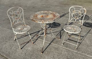 A distressed painted metal garden patio set comprising circular table and two folding chairs (3).