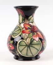 A Moorcroft Pottery Palmata pattern vase, 15cms high. Condition Report Good condition with no damage