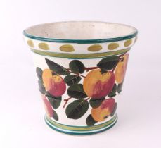 A Wemyss Pottery planter decorated with apples, retailed by T Goode & Co., 18cms high.