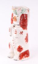 A Staffordshire style jug in the form of a spaniel standing on its hind legs, 25cms high.