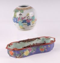 A Chinese famille rose shaped brush washer decorated with gilded bats and flowers on a purple