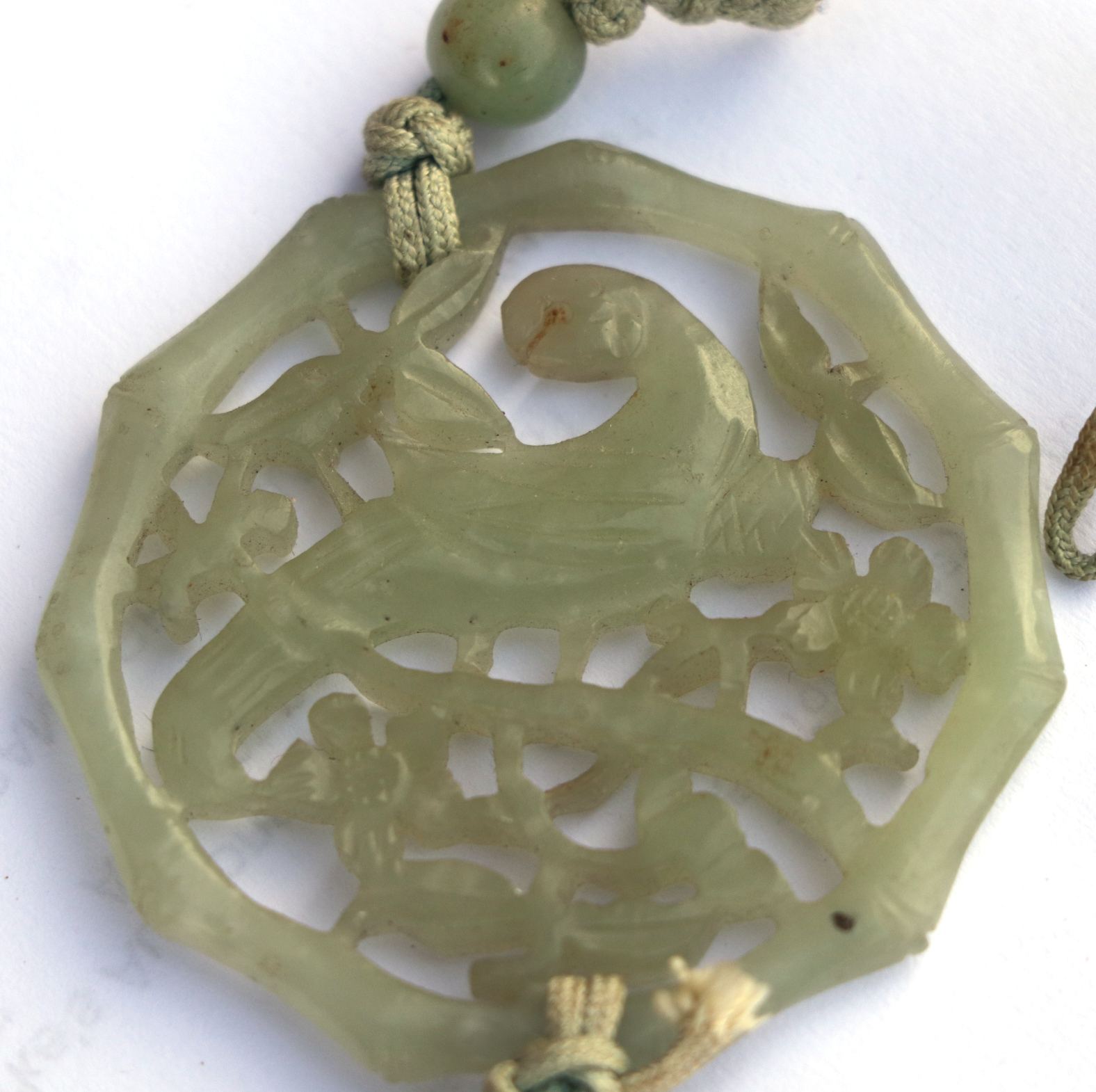 A Chinese pierced jade pendant decorated with a parrot amongst foliage; together with a boxed set of - Image 4 of 4