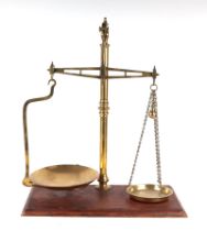 A set of Victorian style brass shop scales, 50cms wide. Condition Report One brass pan is marked '