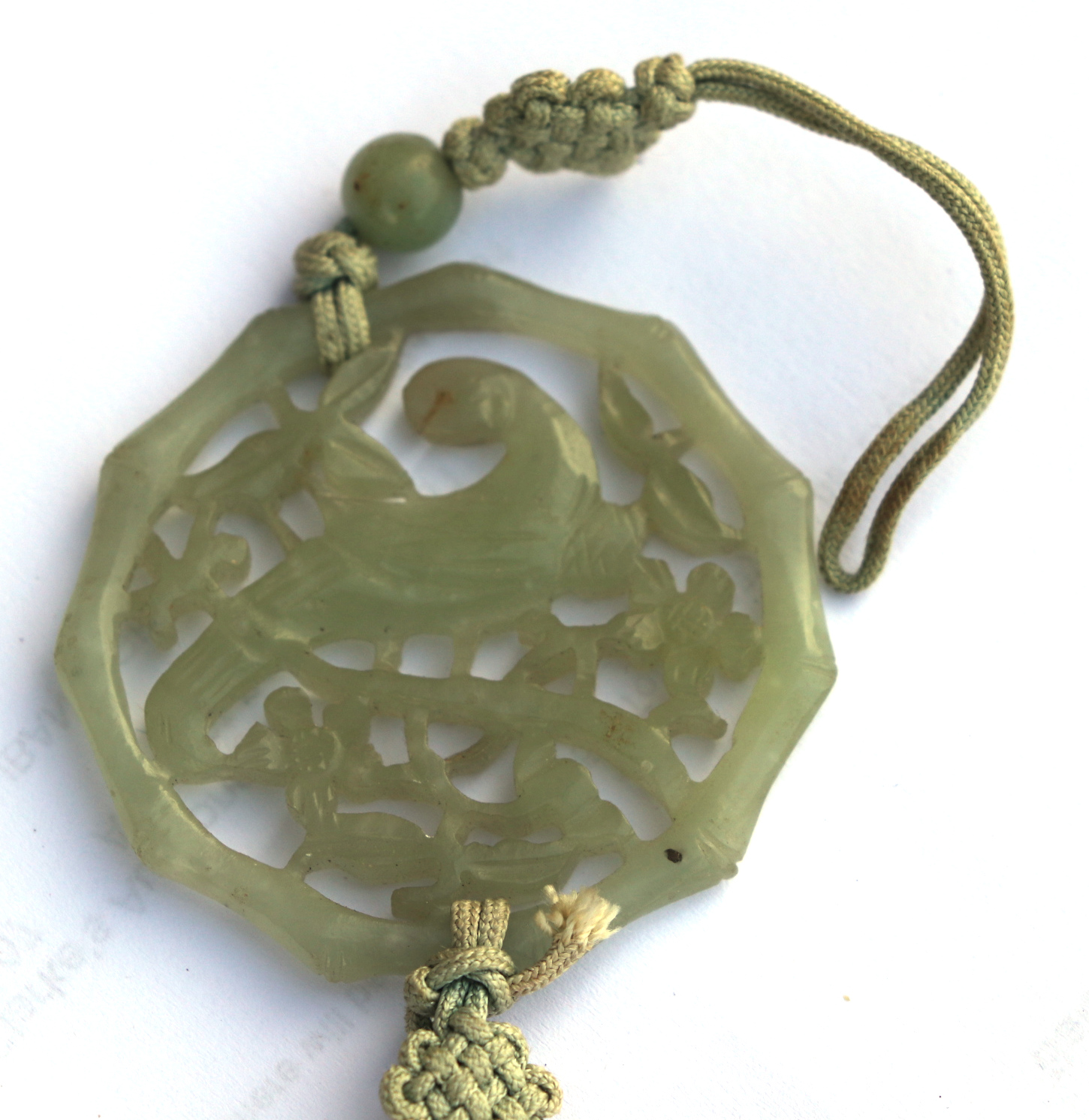 A Chinese pierced jade pendant decorated with a parrot amongst foliage; together with a boxed set of - Image 3 of 4