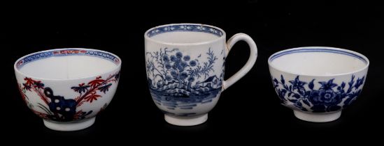 An 18th century Worcester porcelain tea cup decorated with Chinese landscape scenes, blue crescent