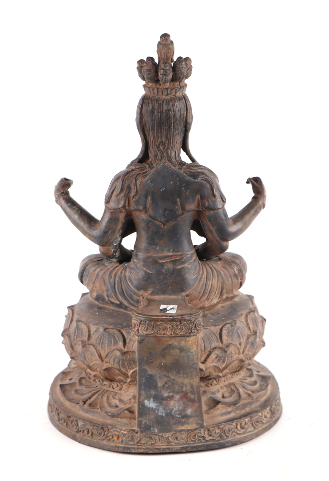 A large patinated metal multi-armed deity seated on a lotus flower, 38cms high. - Image 4 of 4
