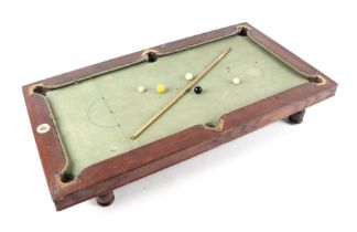 An Edwardian NUKU miniature oak framed slate bed billiards table with adjustable feet, brass mounted