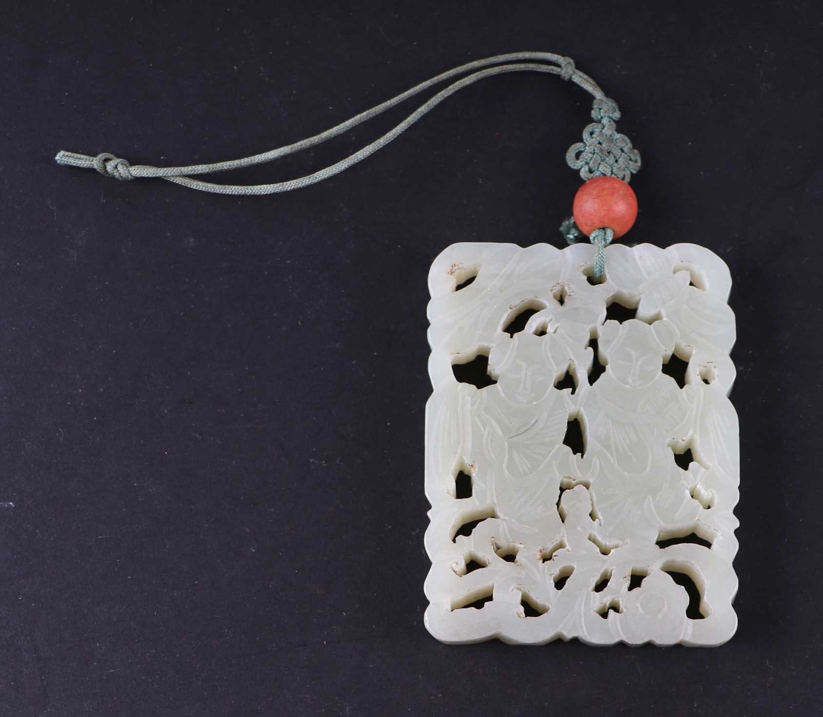 A Chinese pierced jade pendant, 5 by 6.5cms. Condition Report Good overall condition with no visible