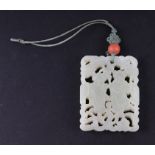 A Chinese pierced jade pendant, 5 by 6.5cms. Condition Report Good overall condition with no visible