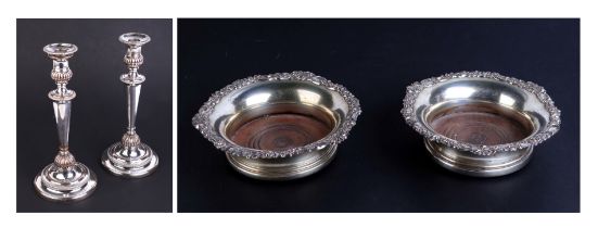A pair of 19th century silver plated wine coasters; together with a pair of Sheffield plate