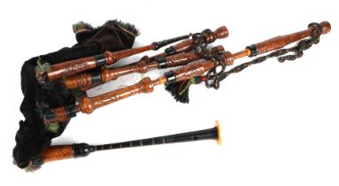 A set of bagpipes bearing the crest for Seaforth Highlanders, with accessories and new leather air