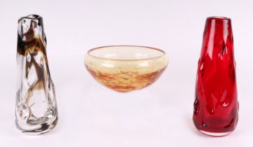 A Whitefriars control bubble amber glass, 20cms diameter; together with a red knobbly glass vase;