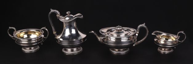 A George III four-piece silver tea set, London 1818 and bearing the crest of possibly for Squire