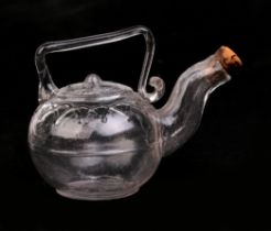 A Victorian miniature glass novelty teapot with impressed registration mark to base, 7cms wide.