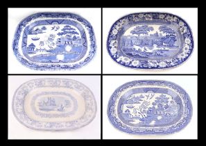 A blue & white transfer printed pottery meat plate, 46cms wide; together with three similar meat