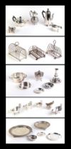 A quantity of assorted silver plated items to include a George III style sauce boats, toast racks,