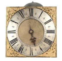 An 18th century brass longcase clock dial and movement, the 26cms square dial with silvered