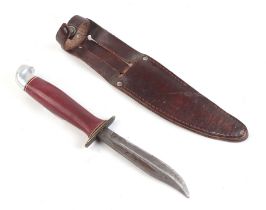 A 1937 Boy Scout jamboree sheath knife and scabbard, the blade etched 'made in Finland' 19cm long