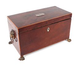 A Regency mahogany tea caddy with two internal compartments and mixing bowl, on lion paw feet, 31cms