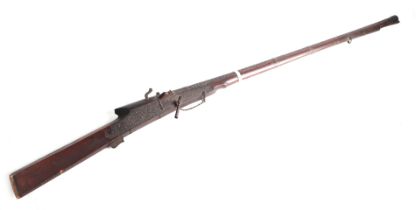 An Indo-Persian Matchlock musket with ornate foliate scroll decoration, 153cms long. Condition