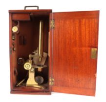 A Baker of London Victorian brass monocular microscope fitted in a mahogany case.