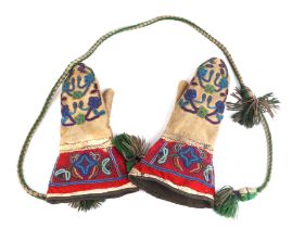 A pair of late 19th / early 20th century Native American gloves with beadwork decoration.