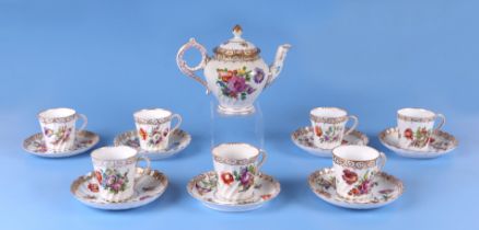 Seven Dresden cups and saucers decorated with flowers; together with a Dresden teapot. Condition