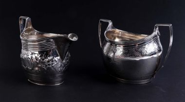 A George III silver milk jug, London 1800; together with a silver twin-handled sugar bowl, London