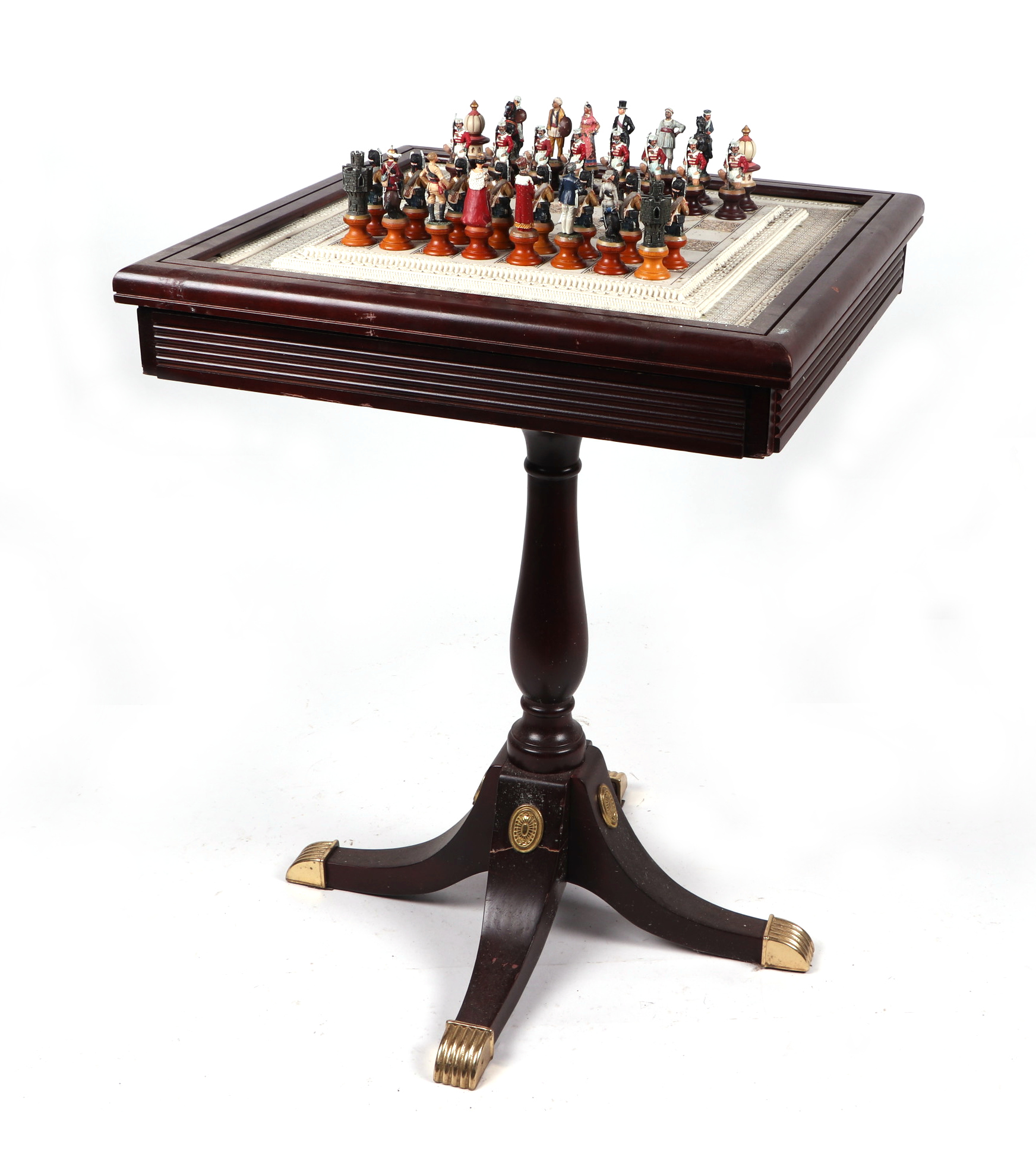 A French Empire style occasional table, the top inset with a chessboard, with two frieze drawers