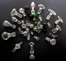 A good selection of glass decanter stoppers to include faceted examples.