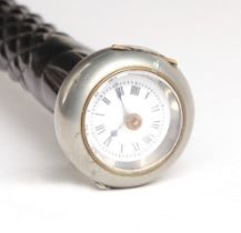 A novelty ebony walking stick, the plated handle with inset open faced watch, 78cms long.